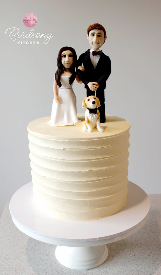 Handmade bride and groom figurine wedding cake